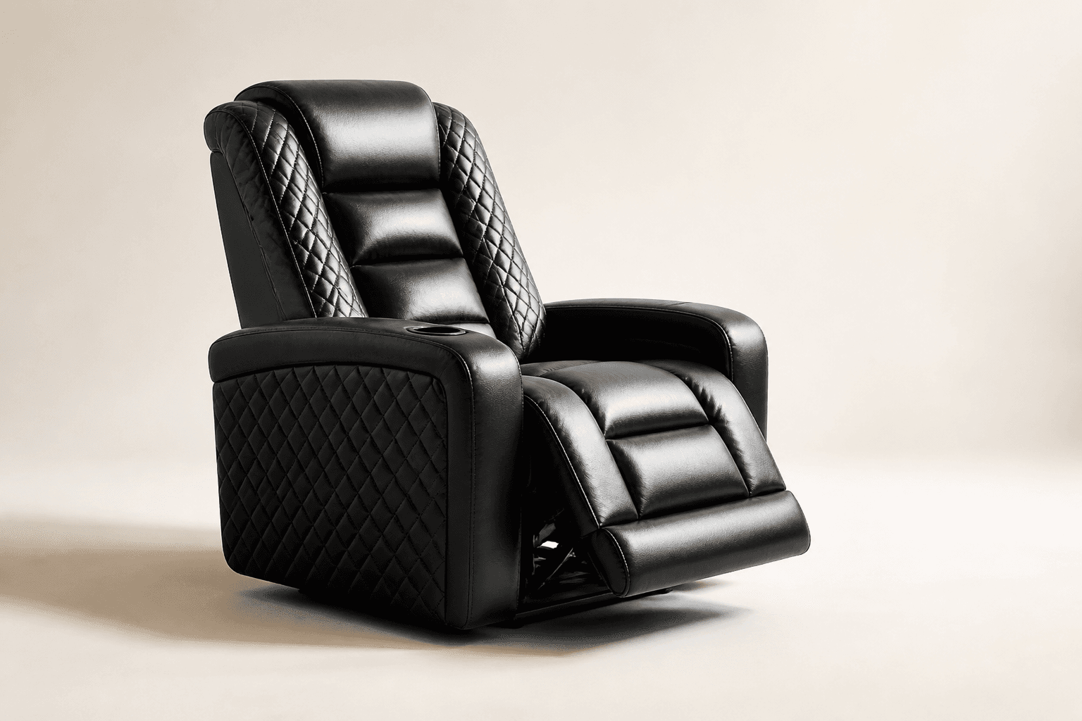 Black leather home-theatre recliner with diamond quilting and a cup holder